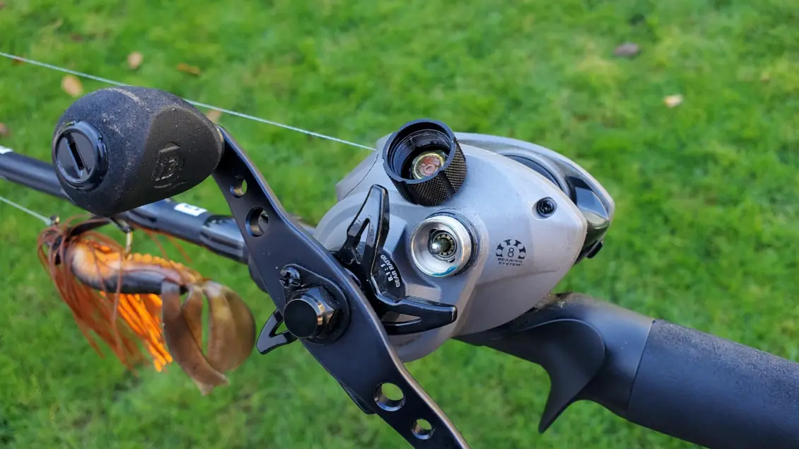 Image of a baitcaster spool tensioning knob how it works showing the material that is pressed against the end of the spool's spindle shaft.