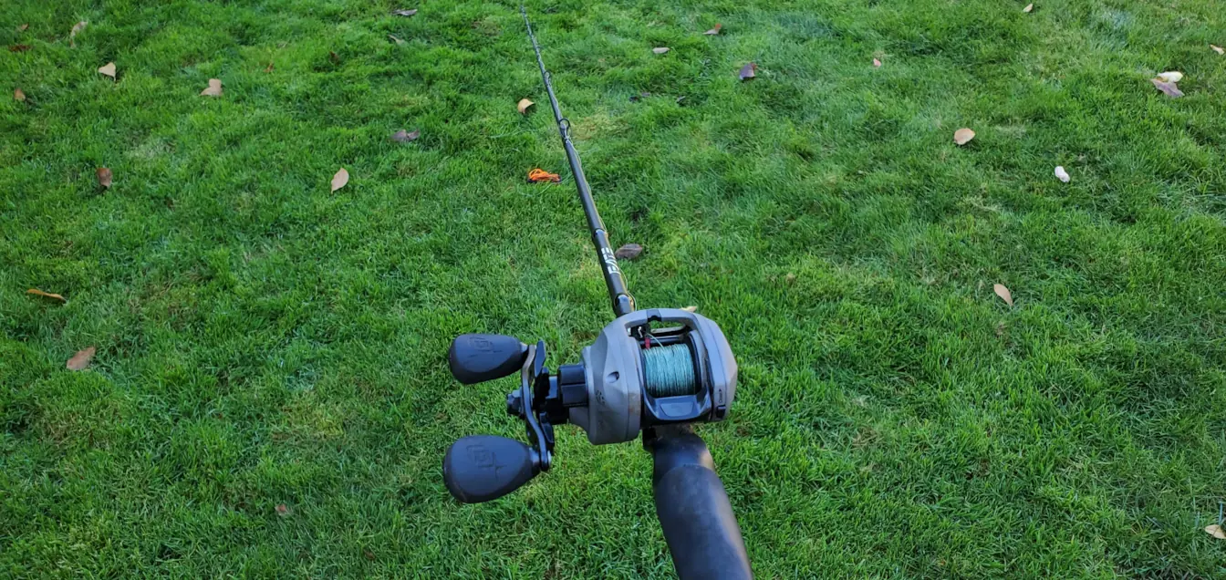 Setting up a baitcaster. Let lure fall to ground and adjust spool to avoid overrun. Set brakes to middle.